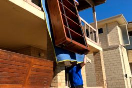 Moving antique furniture over a balcony